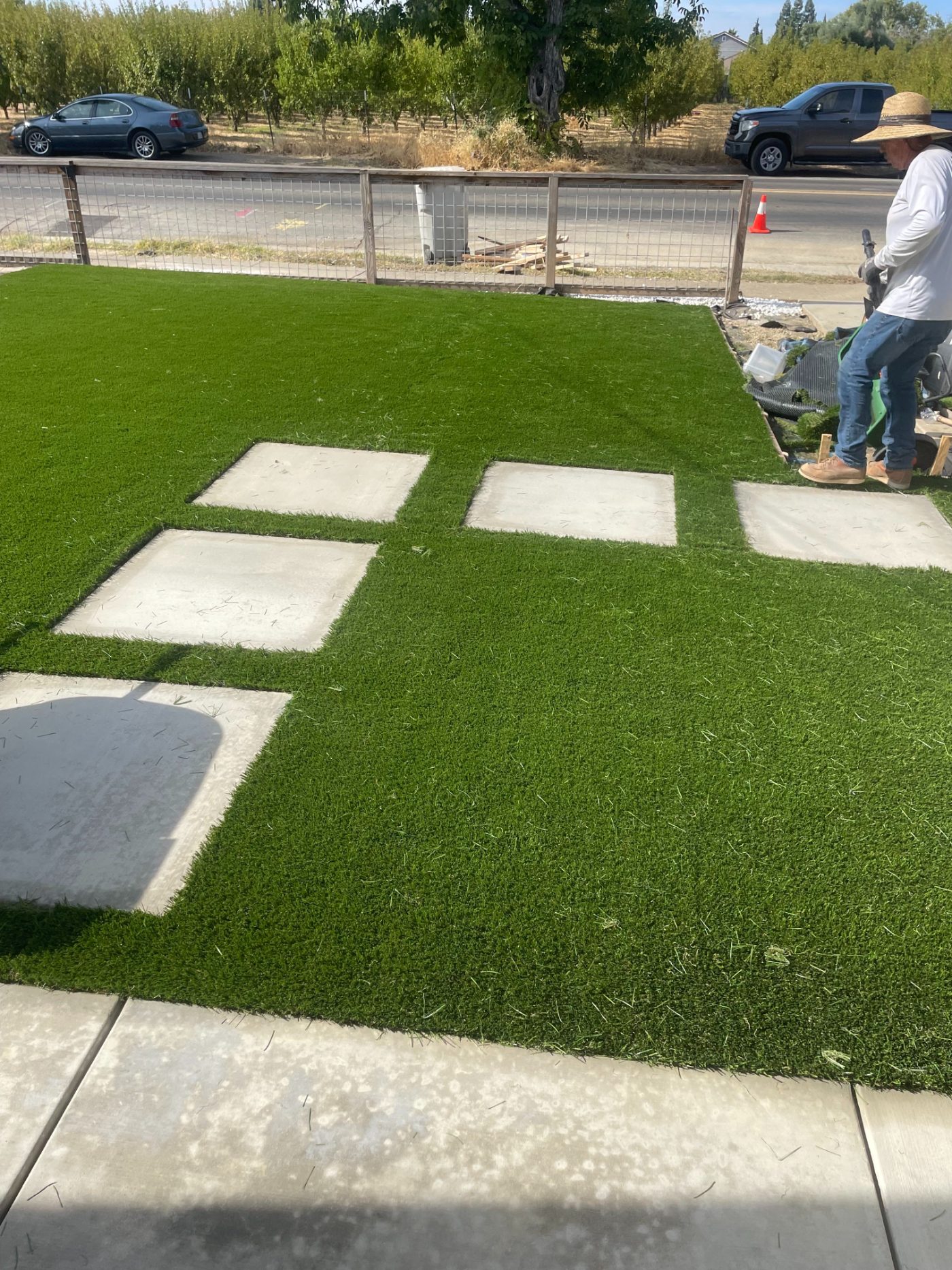 Concrete paver stepping stones set into turf in a Sacramento front yard